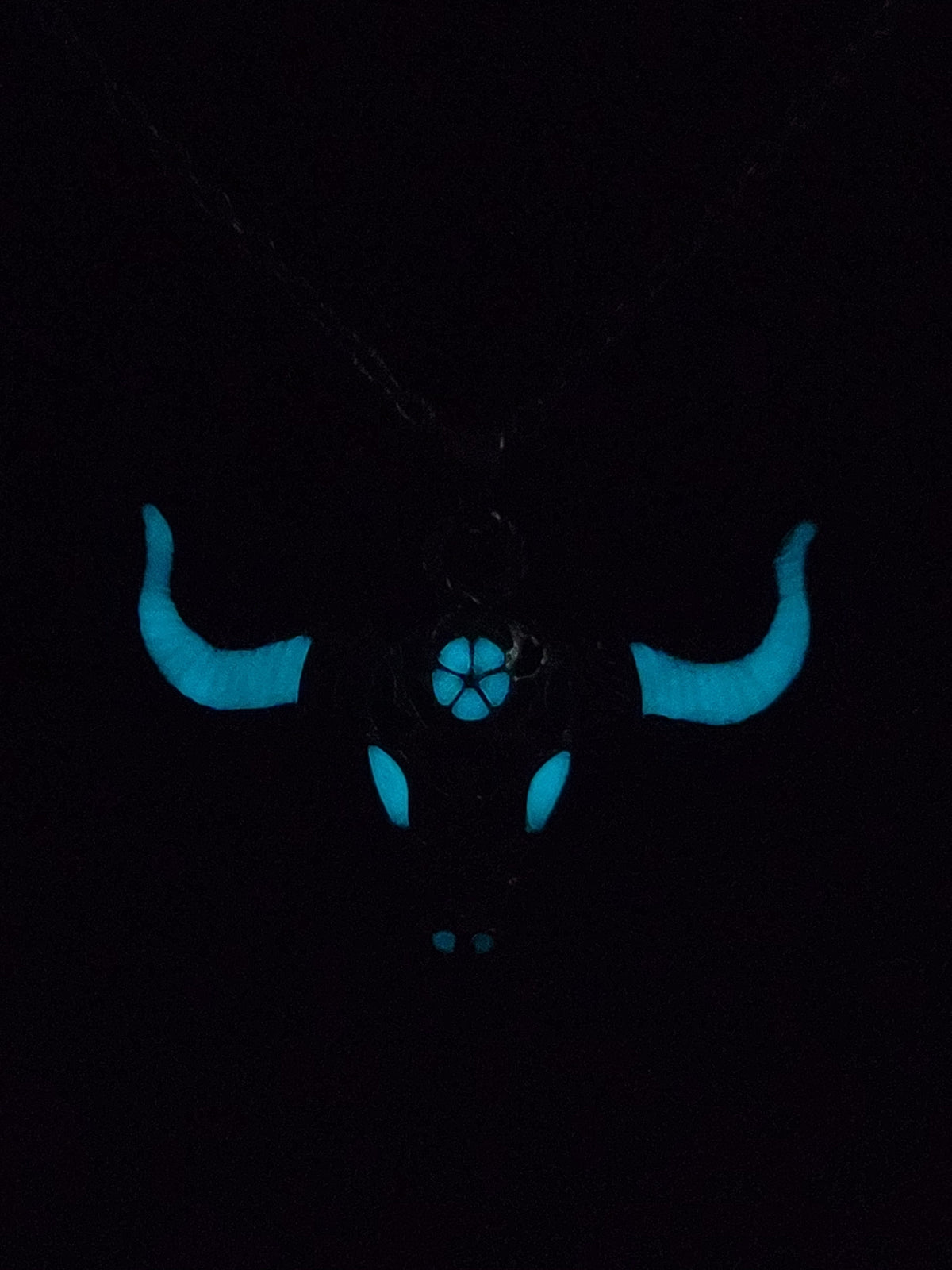 Unisex buffalo skull pendant necklace with luminous stone inlay that glows after charging with light