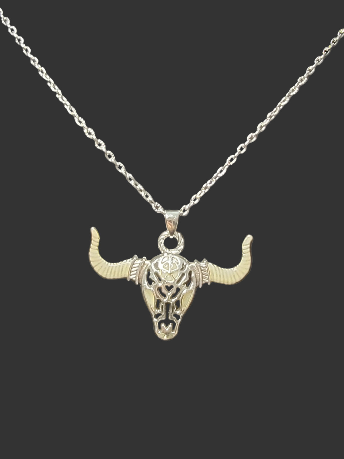 Fearless buffalo skull glow-in-the-dark silver pendant necklace symbolizing strength and perseverance