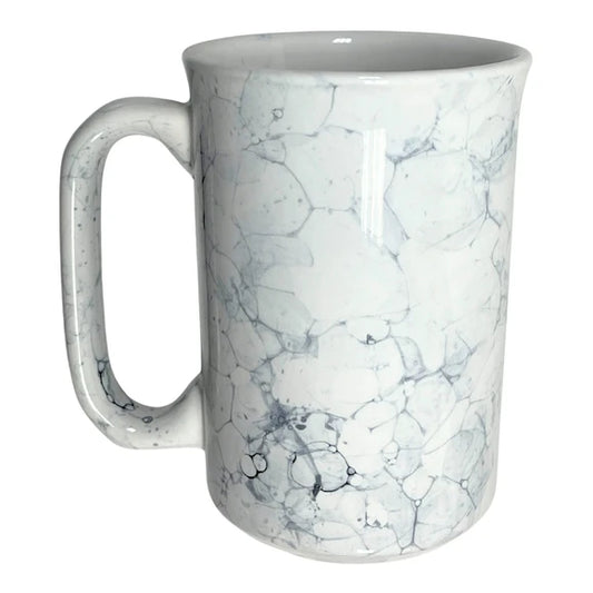 Marble ceramic coffee mug styled on a café table ready for daily service