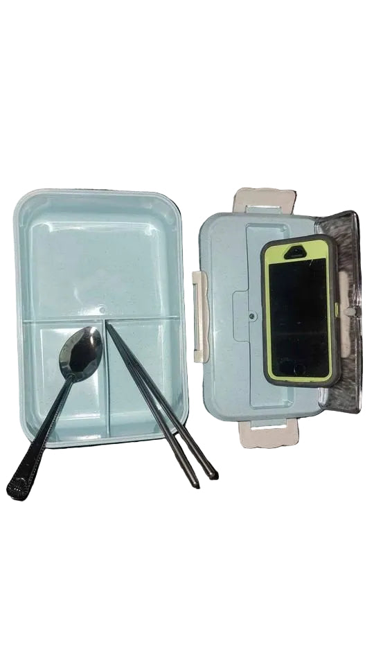 pink bento lunch box open showing 3 compartment design for separating meals and snacks